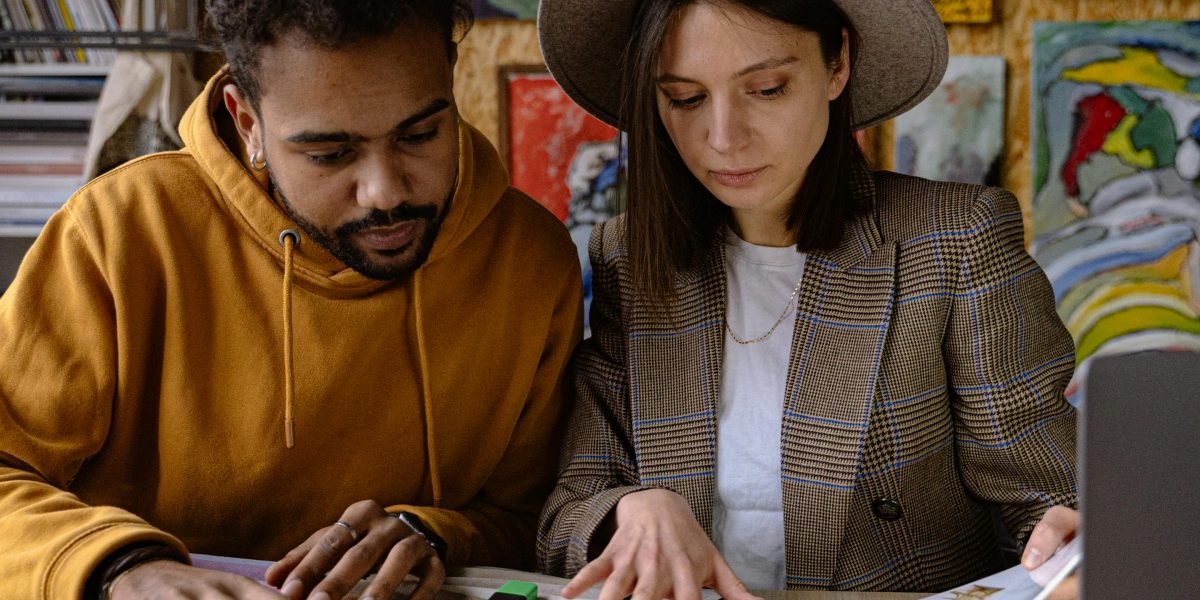 Creative professionals working together, embodying the innovative spirit and challenges faced as AI blurs the lines between fiction and reality in film production.