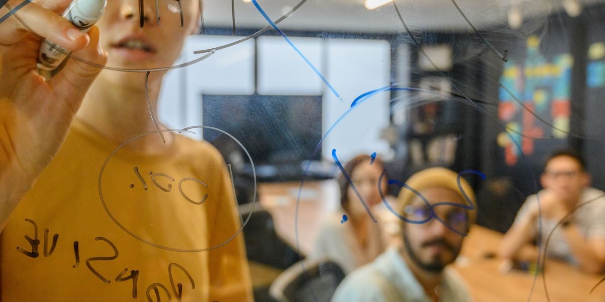 A creative professional sketching ideas, symbolizing the imaginative process behind new sci-fi narratives inspired by AI.